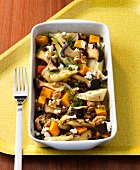 Roasted vegetables with bread crumbs in serving dish