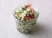Herbs and bacon spread in small jar