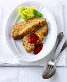 Almond roast bread with cabbage and sauce on plate