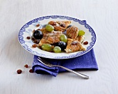 Tripe with raisins and nuts on plate