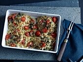 Noodles with tomatoes and mozzarella in serving dish
