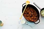 Pork stew with sauerkraut in casserole