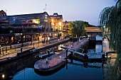 View of Illuminated Regent's Canal in evening, Camden Town, London, UK