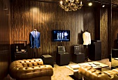 Room of fashion designer Ozwald Boateng with sofa, Dressmakers model and TV, London, UK
