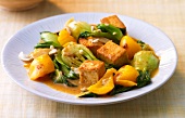 Thai tofu curry with pak choi on plate