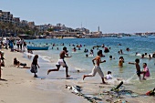 People enjoying on beach in Alexandria, Egypt
