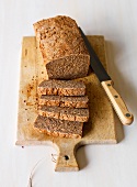 Pieces of linseed bread on wooden board