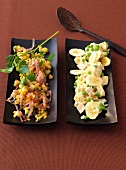 Spicy lentil salad and chicken salad with banana on tray