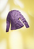 Close-up of purple braid jacket on yellow background