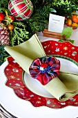 Scots look napkin ring on Christmas plate with place card in cinnamon sticks
