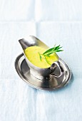 Béarnaise sauce with tarragon in a gravy boat