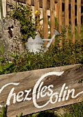 Sign board of Chez les Colin in garden of Maison d'hotes Chez les Colin, France