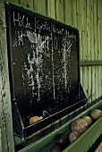 Black board on wall of bowling alley