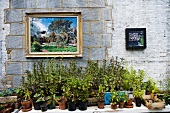 View of Dalston Eastern Curve Garden wall with painting, Hackney, London, UK