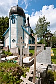 Graves in front of Wojnowo Church in Mikolajki, Warmia-Masuria, Poland