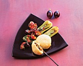 Asian yeast dumplings with eggplant and vegetables on ceramic plate