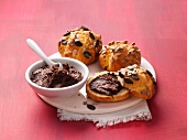 Gluten-free buns with bowl of chocolate chestnut cream on platter