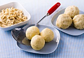 Gluten free noodles and dumplings on plates