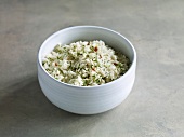 Rice with dill and pepper in bowl