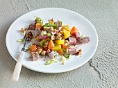 Veal fruity salad on plate