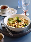 Mie noodles with broccoli in bowl