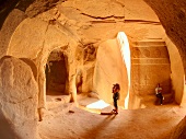 Tourist at Zelve tuff cave in Cave village, Cappadocia, Turkey