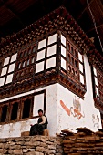 Man sitting at old Drukgyal Dzong in Paro, Bhutan