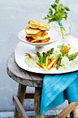 Steamed spring vegetables with a herb sauce and wild garlic pancakes