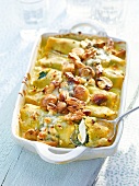 Cannelloni with chicken and ricotta filling in serving dish