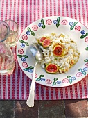 Risotto with lardo, figs and rosemary on plate