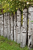 Wooden sculptures in a row, Galindia Mazurski Eden, Warmia Masuria, Poland