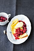 Austrian pancakes with cherry sauce and honey ice cream