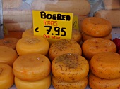 Farmhouse cheese with price written on tag at the market in de Pijp, Amsterdam