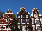 Low angle view of typical canal houses at Prinsengracht, Amsterdam, Netherlands