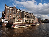 View of ferryboats at canal in Rokin, Amsterdam, Netherlands