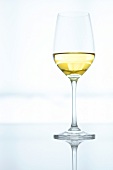 Close-up of white wine in wine glass