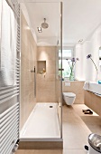Bathroom with beige cubicle shower