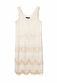 Close-up of white fringe dress on white background