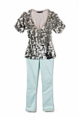 Silver pailletten top with blue pants on white background