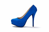 Close-up of royal blue plateaus pumps on white background