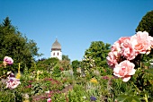 View of house and garden at Woman Island, Chiemsee, Chiemgau, Bavaria, Germany