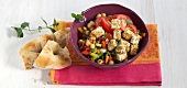 Arab chick-pea salad with pita bread in bowl
