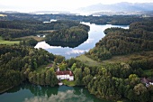 View of castle Hartmannsberg around Eggstatt Hemhofer Lake in Bavaria, Germany