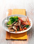 Salad with turkey strips on plate