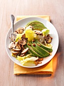Avocado salad with mushrooms on plate