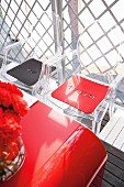 Red and black felt seat cushions with cut out words