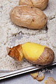 Peeled potatoes on ricotta cheese