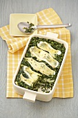 Kale with lasagne and cheese in serving dish