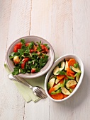 Vegetables salad with tomatoes and peaches in bowls on wooden table