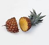 Close-up of pineapple cut into half, white background